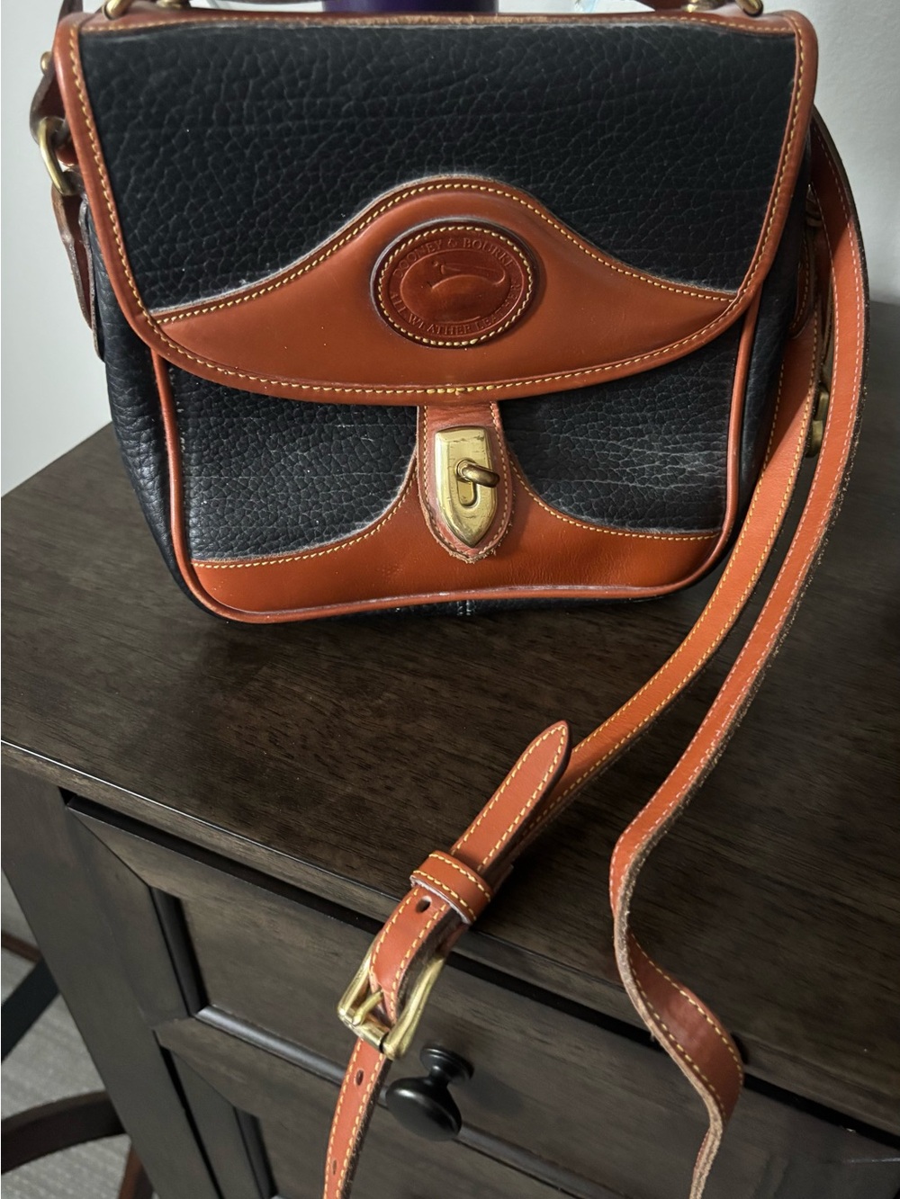 Dooney & Bourke Black and Tan Pebbled Leather Crossbody
